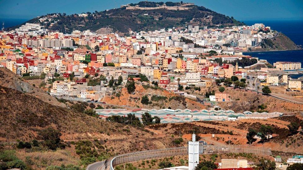 A picture taken from the Moroccan town of Fnideq shows a general view of Spain's North African enclave of Ceuta which lies on the Strait of Gibraltar on August 29, 2020.