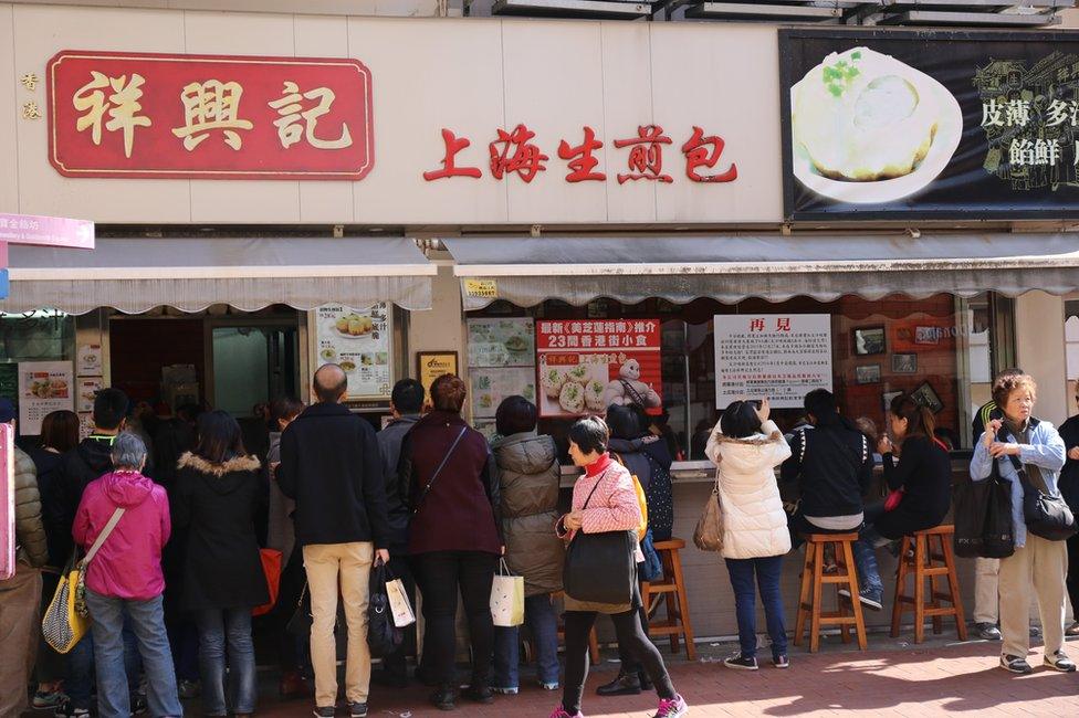 Customers queuing up outside the dumpling shop