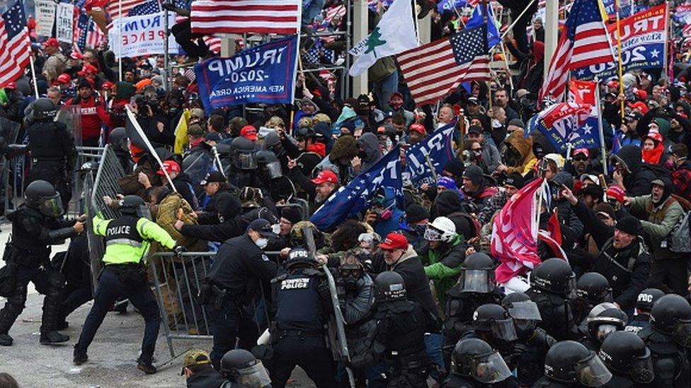 Trump supporters clash with police and security forces as they push barricades to storm the US Capitol