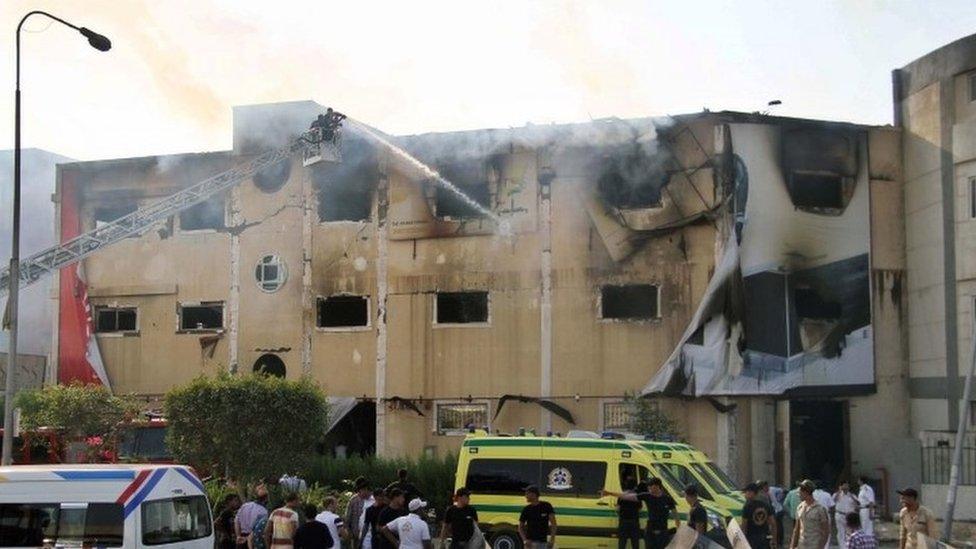 Egyptian emergency services battle a fire at a factory near Cairo