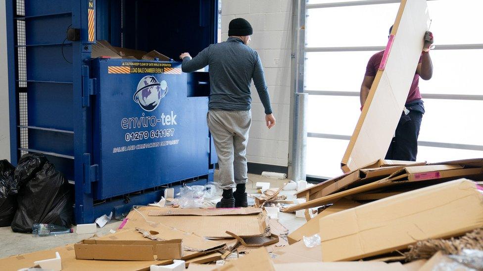 Prisoners work in the recycling centre at category C prison HMP Five Wells in Wellingborough