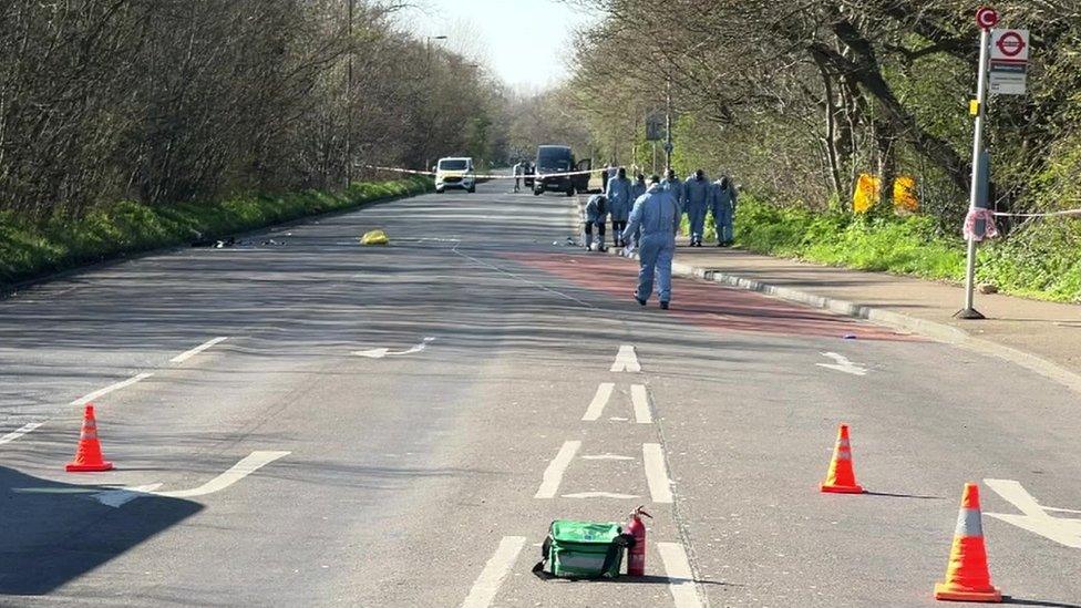 Forensics officers in Croydon Road in Mitcham, near the junction with Beddington Lane.