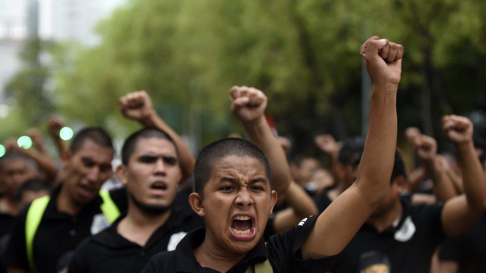 Students and activists take part in a demonstration to mark the fourth anniversary of the disappearance of 43 students of the teaching training school in Ayotzinapa, in Mexico City, on September 26, 2018.