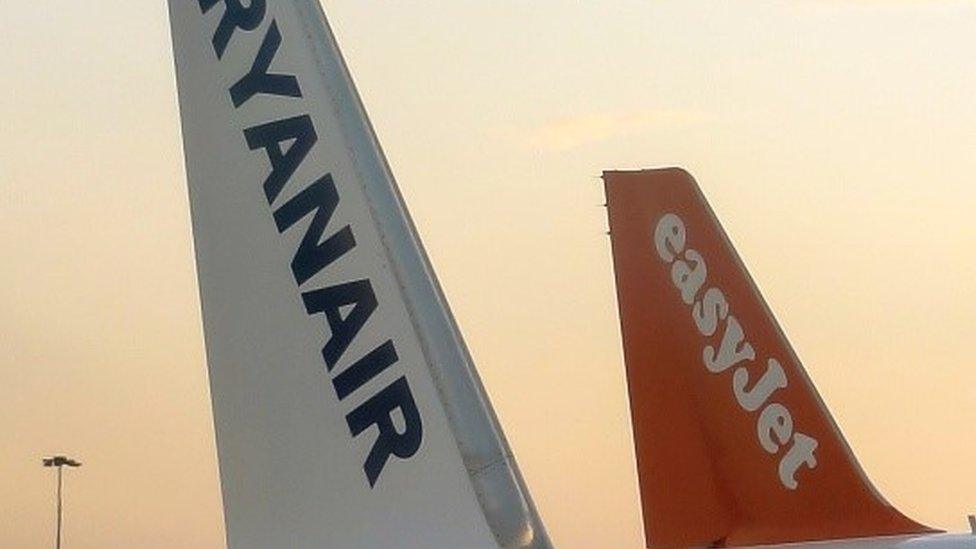 Tail fins of EasyJet and Ryanair planes