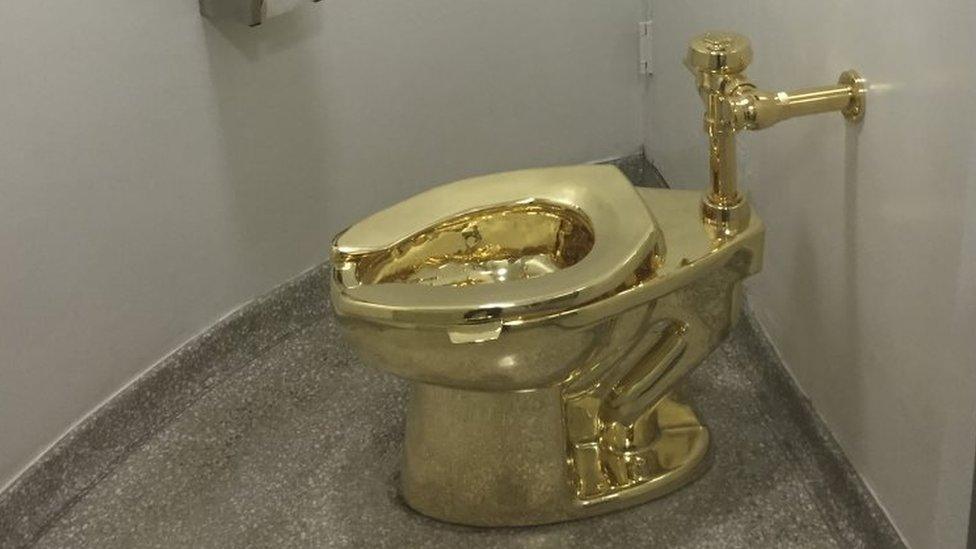 The fully functioning solid gold toilet created by Italian artist Maurizio Cattelan