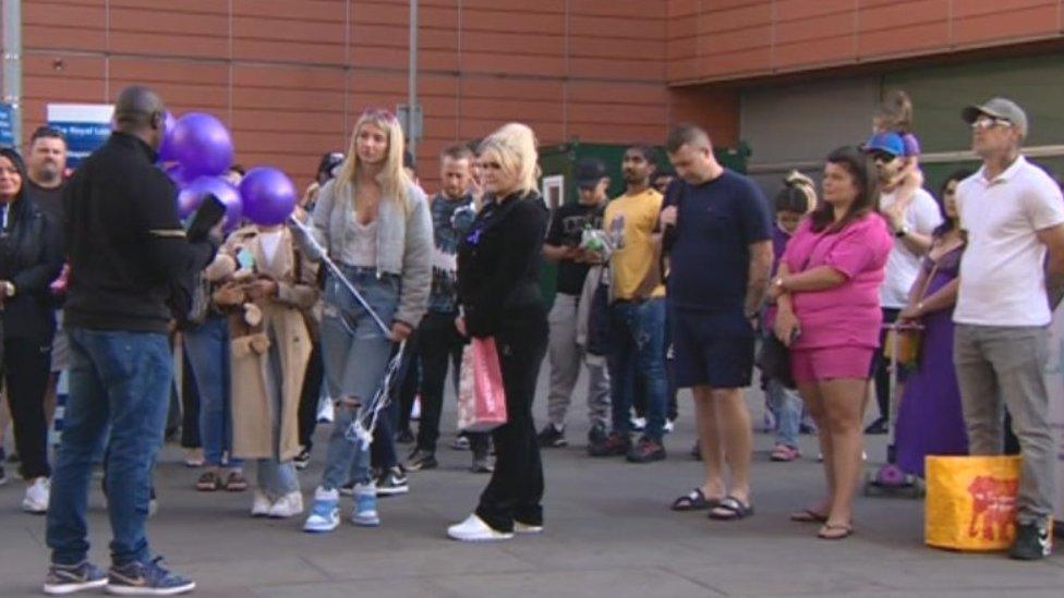 People at a vigil for Archie Battersbee