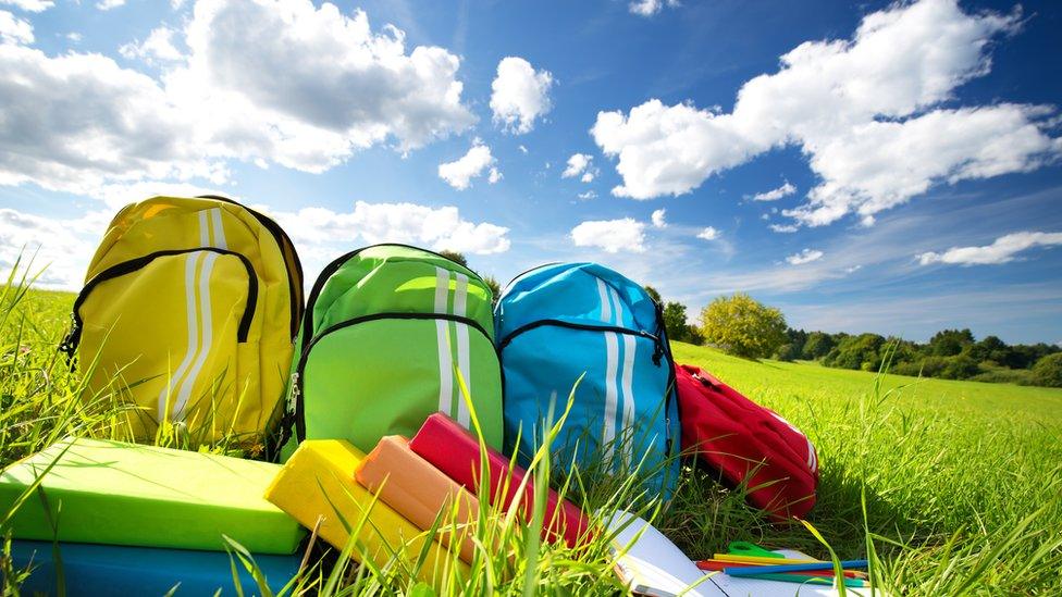 Bags-lying-on-a-sports-field.