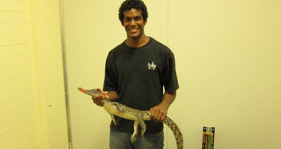 Mr Nagloo holding a crocodile