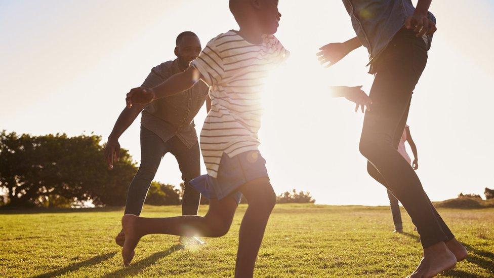 A family run around in the heat.