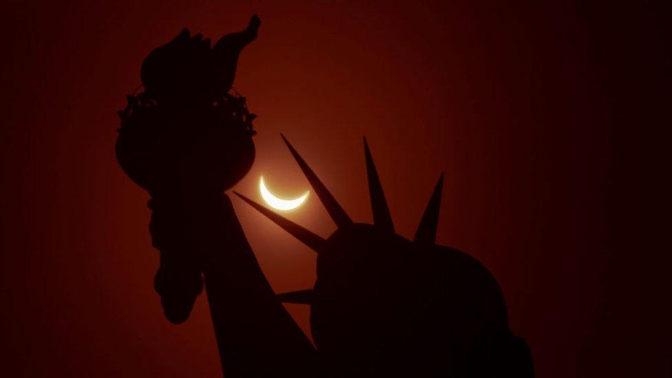 Statue of Liberty and partial eclipse