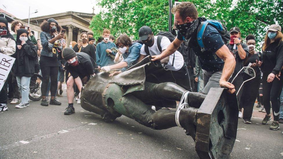 Protesters removing the statue of Edward Colston