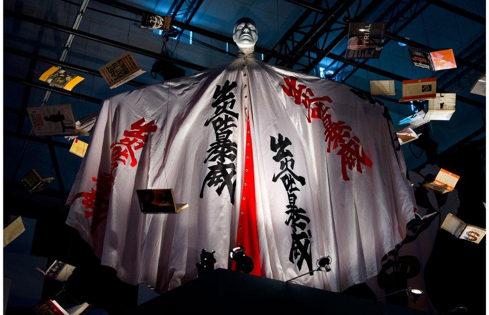 An outfit worn by musician David Bowie is displayed at the 'David Bowie is' exhibition at the Victoria and Albert (V&A) museum in central London on 30 March 2013