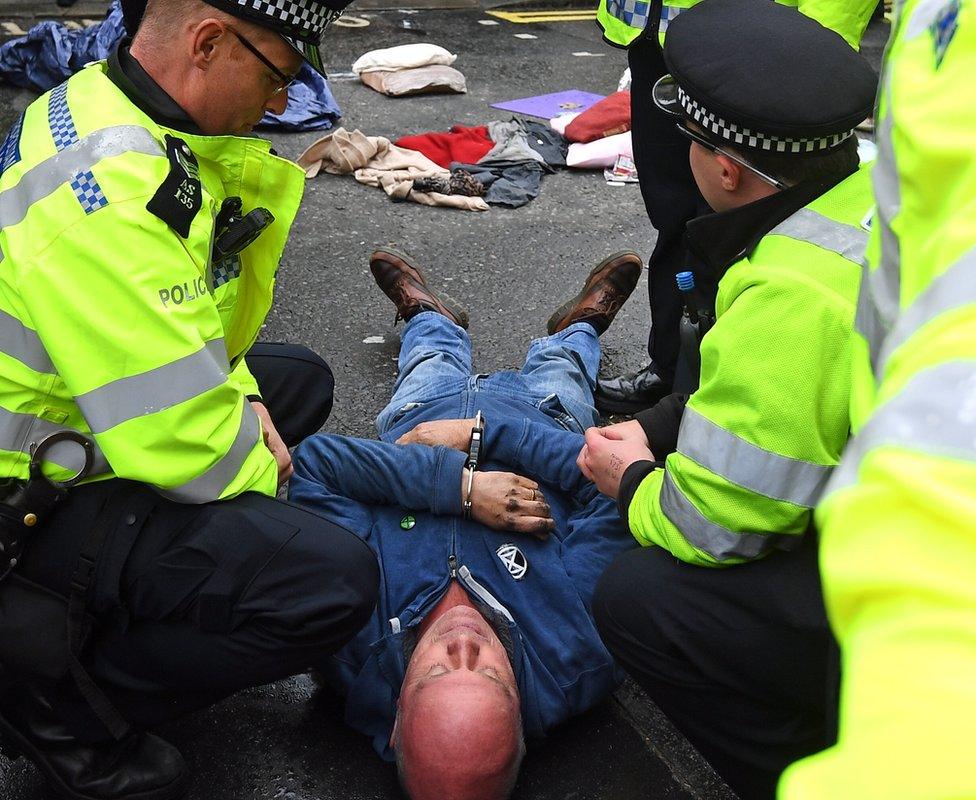 Police cut free a protester