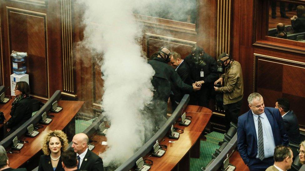 Opposition MPs release tear gas device in Kosovo's parliament in Pristina (10 March)