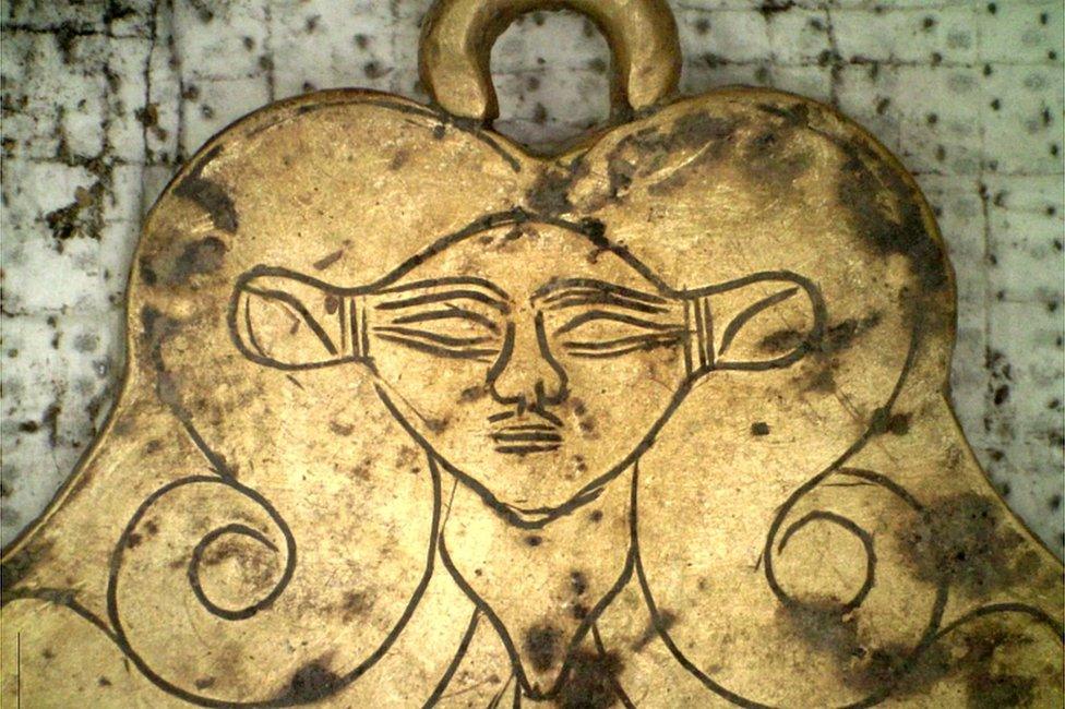 A pendant depicting the head of ancient Egyptian goddess Hathor