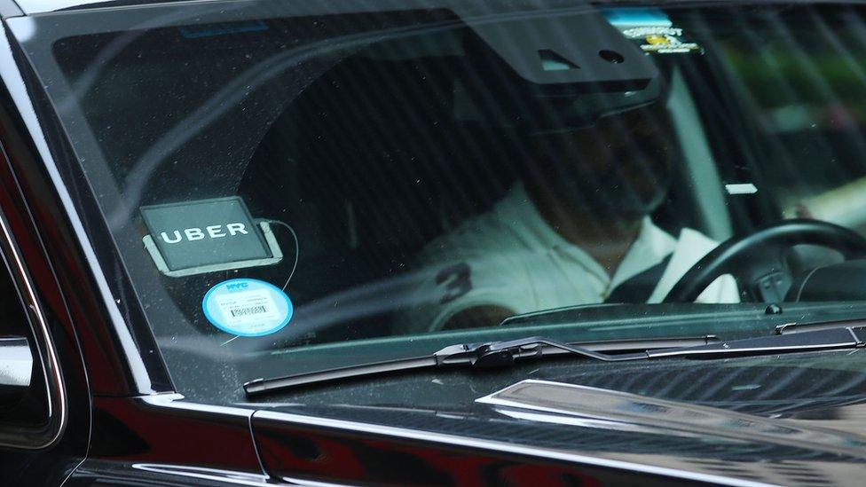 An Uber SUV waits for a client in Manhattan