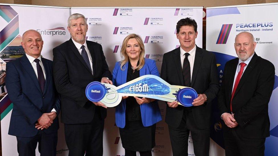 Pictured (left-right) are Ian Campbell, Director of Service Operations, Translink, Minister John O’Dowd, Department for Infrastructure, Gina McIntyre, CEO SEUPB, Minister Eamon Ryan TD, Department of Transport and Billy Gilpin, Director Train Operations, Iarnród Éireann.