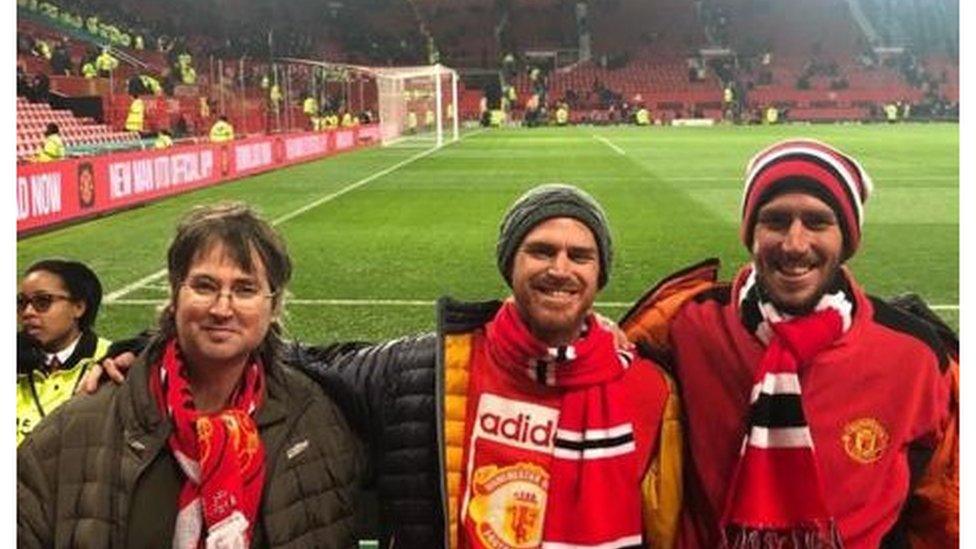 Yoni, in the middle, at Old Trafford with friends