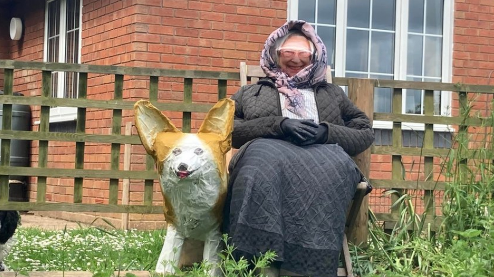 Queen and Corgi scarecrow