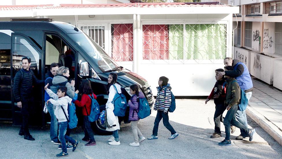 Refugee children boarding a bus in Oraiokastro, near Thessaloniki, 20 Feb 17