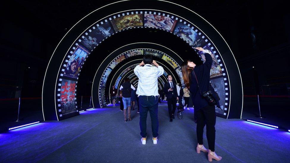 People visit a film studio at Wanda Film industrial park in Qingdao, China's Shandong province on April 28, 2018