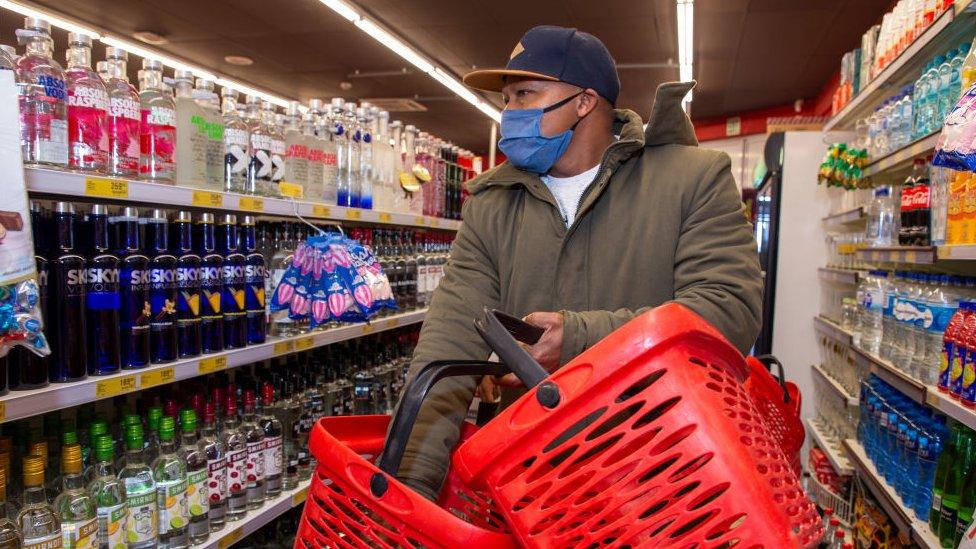 A customer buying alcohol