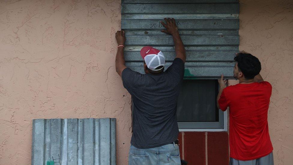 Florida residents put up shutters in preparation for Hurricane Irma