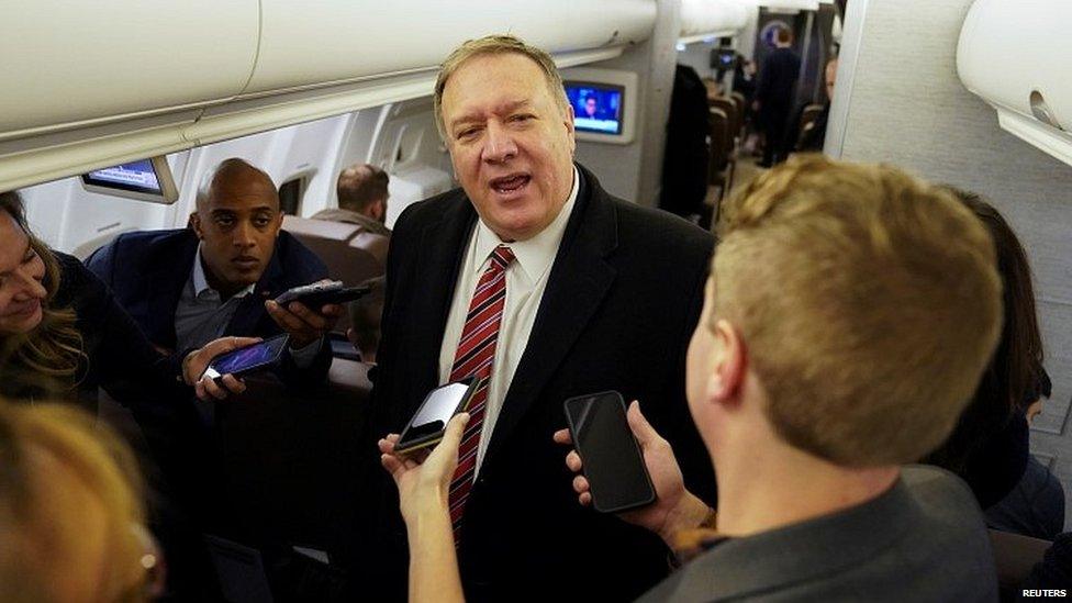 Mike Pompeo talking to reporters on the plane to London