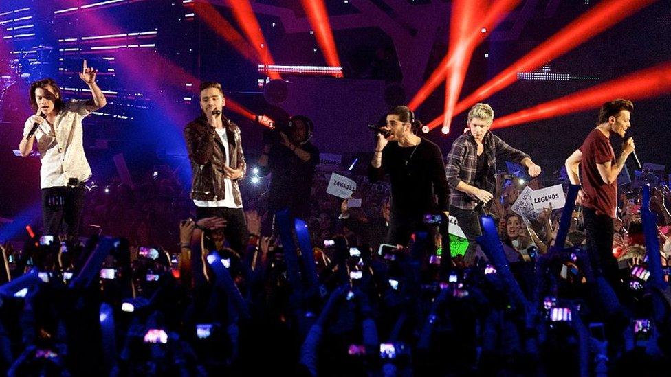 One Direction performing on stage