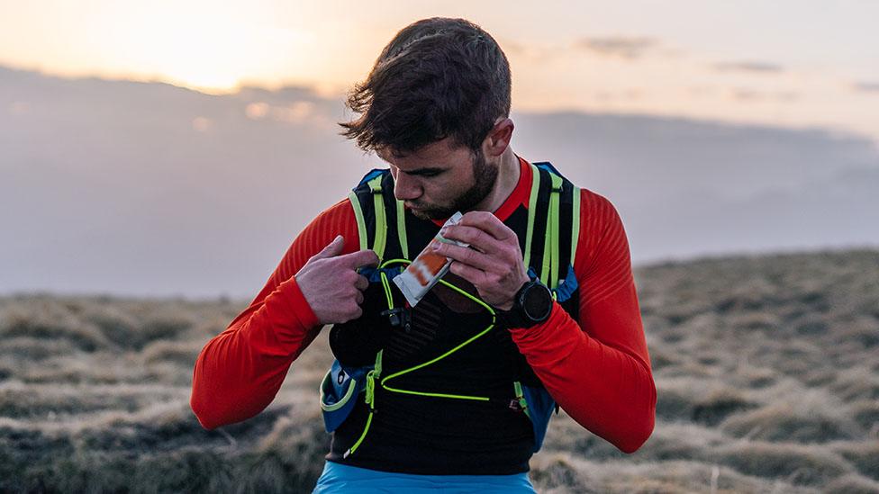 Runner tucks away a protein bar snack