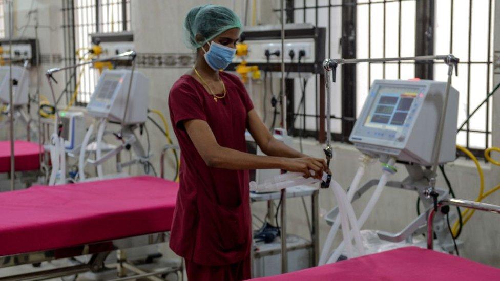 A medical staff checks on a ventilator of an intensive care unit at a newly inaugurated hospital by the Tamil Nadu state during a government-imposed nationwide lockdown as a preventive measure against the COVID-19 coronavirus, in Chennai on March 27, 2020.