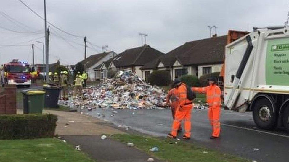 Bin lorry emptied on road