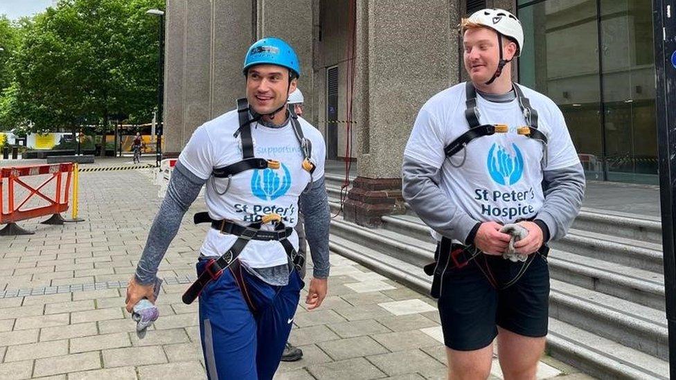 Abseilers wearing St Peter's Hospice t-shirts