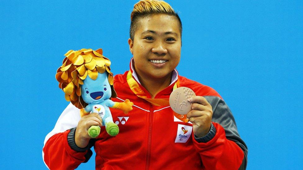 Singapore's Theresa Goh celebrates with her bronze medal