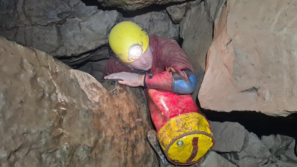 Caver in Ogof Ffynnon Ddu cave system