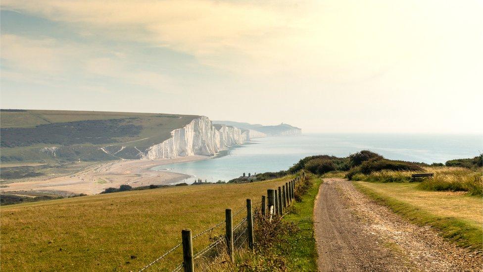 photo-of-cliff-with-beach-in-background