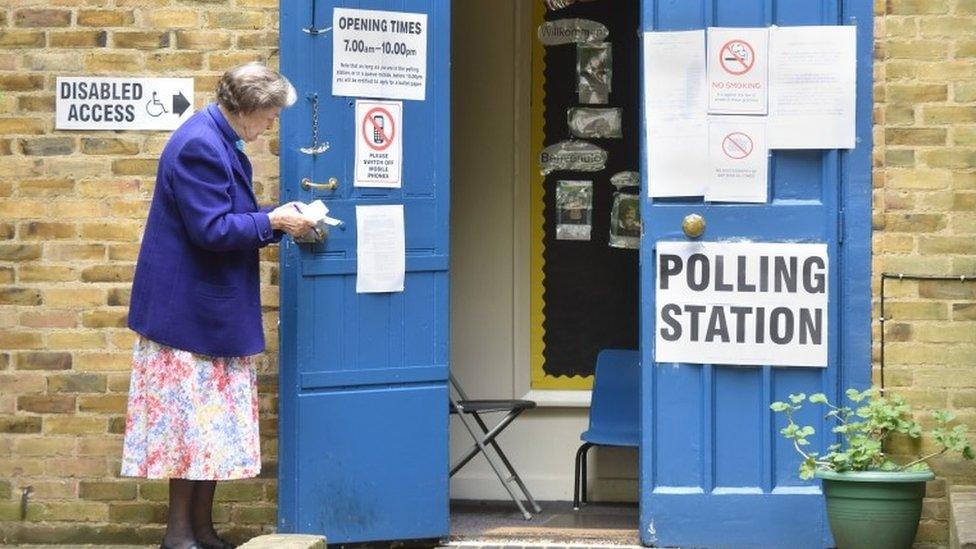 Polling Station at St John's Church Hall Hyde Park with Conservative constituency teller standing outside on 07/05/2015, as Britain holds a general election