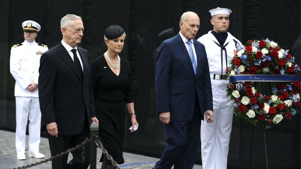 US Defence Secretary James Mattis (2-L), General John Kelly (2-R), White House Chief of Staff and Cindy McCain (C), wife of late Senator John McCain, arrive to lay a ceremonial wreath honouring all whose lives were lost during the Vietnam War at the Vietnam Veterans Memorial in Washington D.C