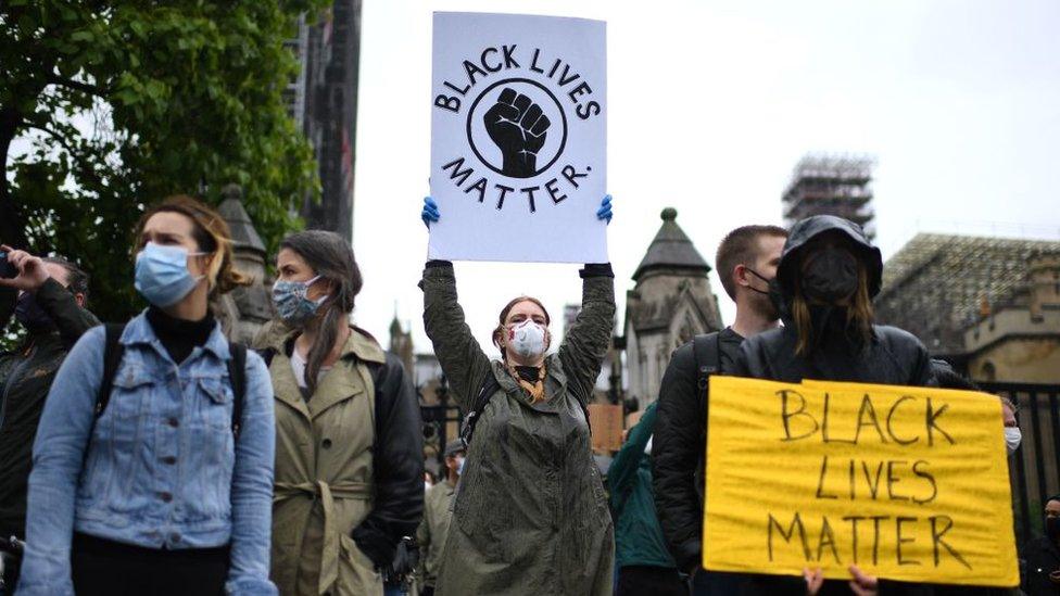 protestors-with-signs-in-London.