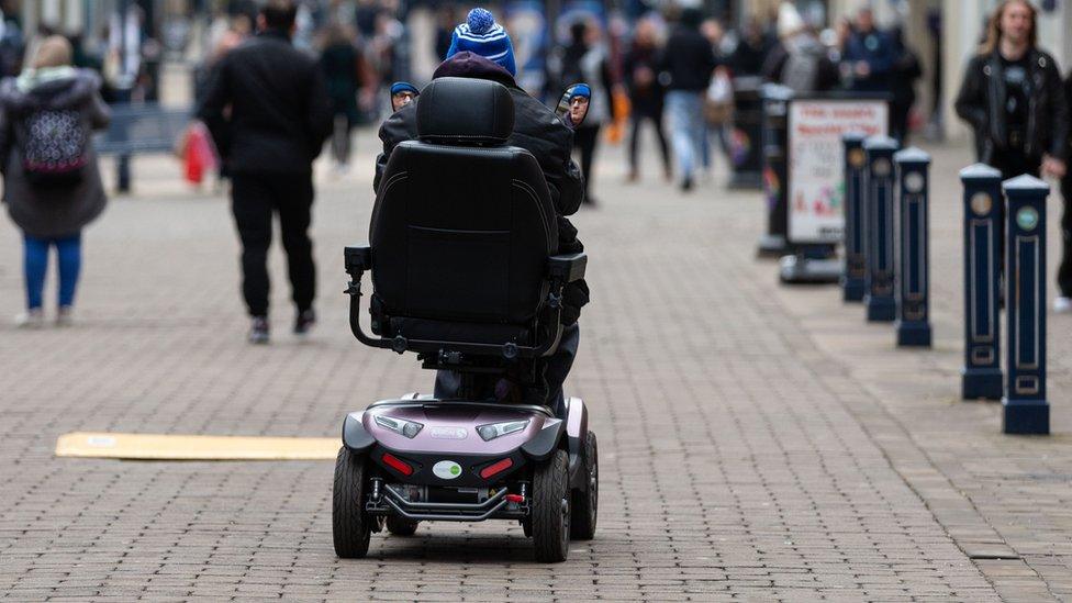 A generic image of a person in a mobility scooter