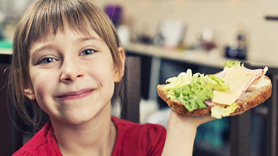 girl making a sandwich