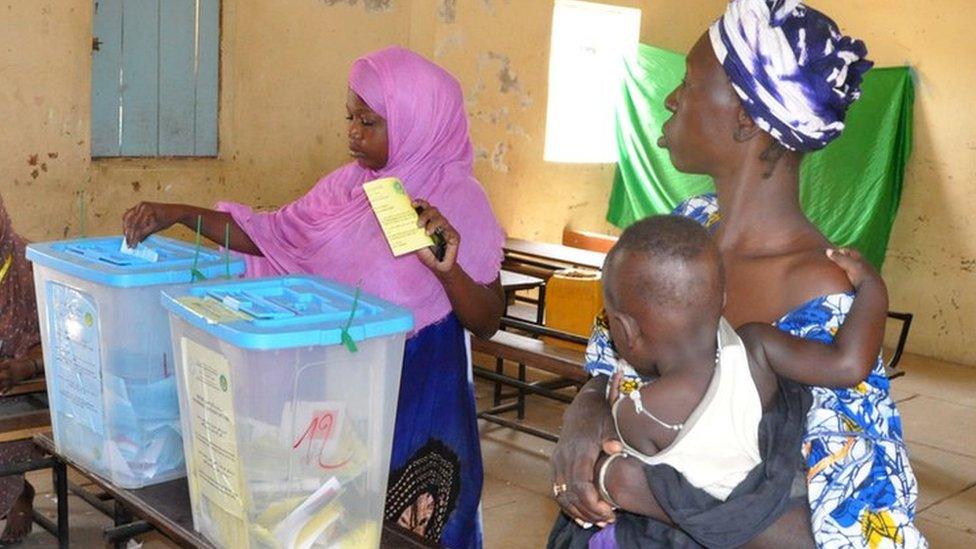 A woman casts her vote in country's constitutional referendum on 5 August at the polling station in Nouakchott