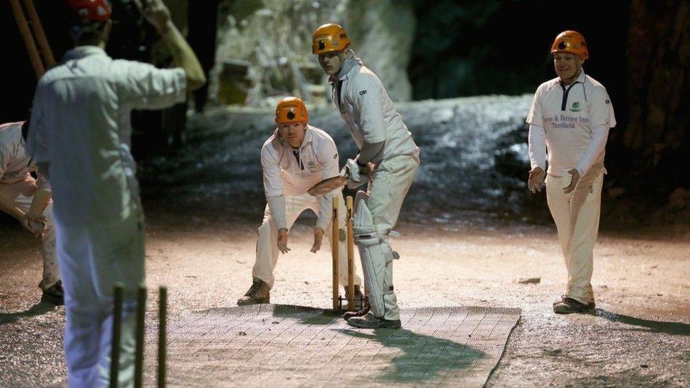 Cricket being played in a cave