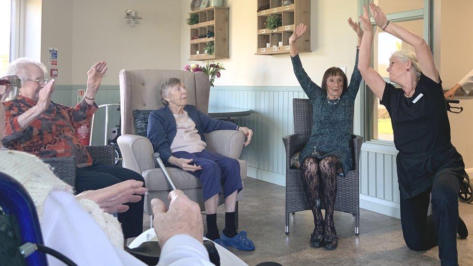 Care home residents in an exercise class