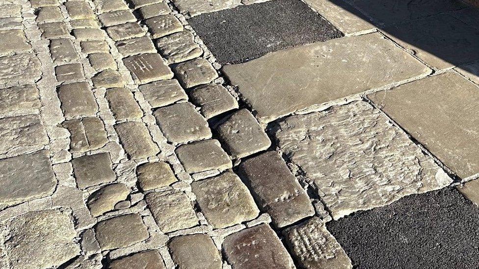 Tarmac infills on cobbled path