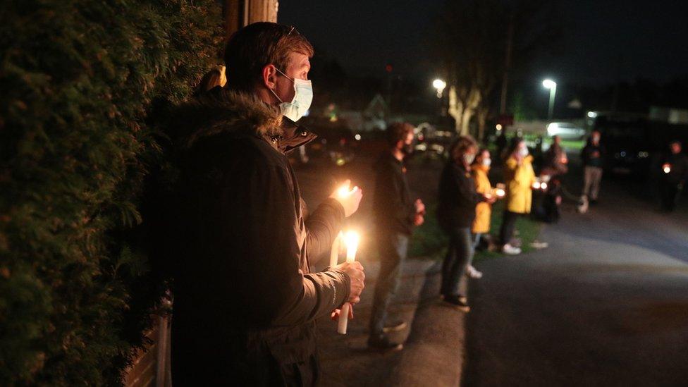 Members of the public outside the Old House at Home pub in Dormansland, Surrey, during the National Day of Reflection, on the anniversary of the first national lockdown to prevent the spread of coronavirus.