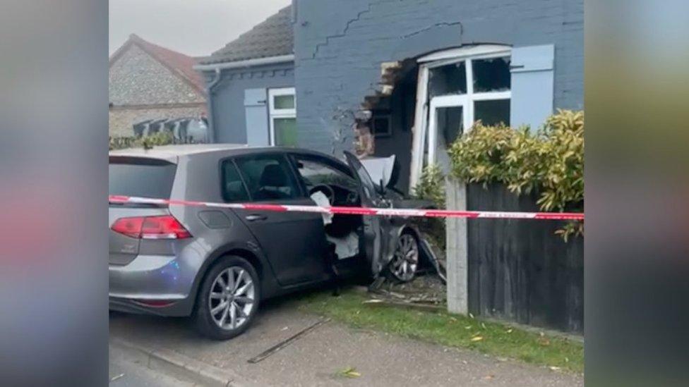 Car crashed into house