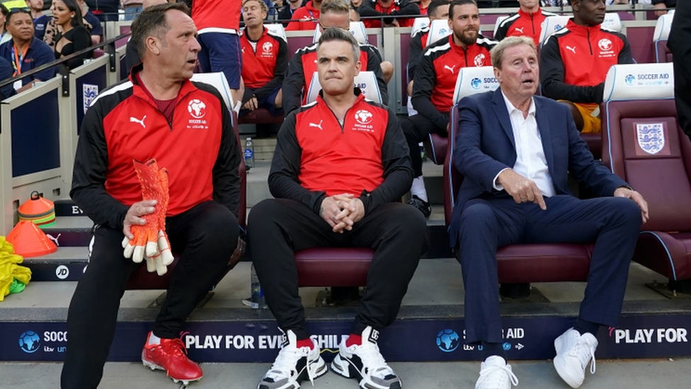 England manager Harry Redknapp (right) with coaches Robbie Williams (centre) and David Seaman before the Soccer Aid for UNICEF match