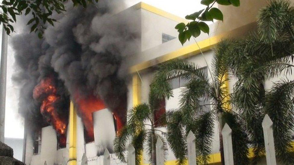 Smoke and flames billow from a factory window in Binh Duong on 14 May as anti-China protesters set several factories on fire in Vietnam, according to state media, in an escalating backlash against Beijing's deployment of an oil rig in contested waters.