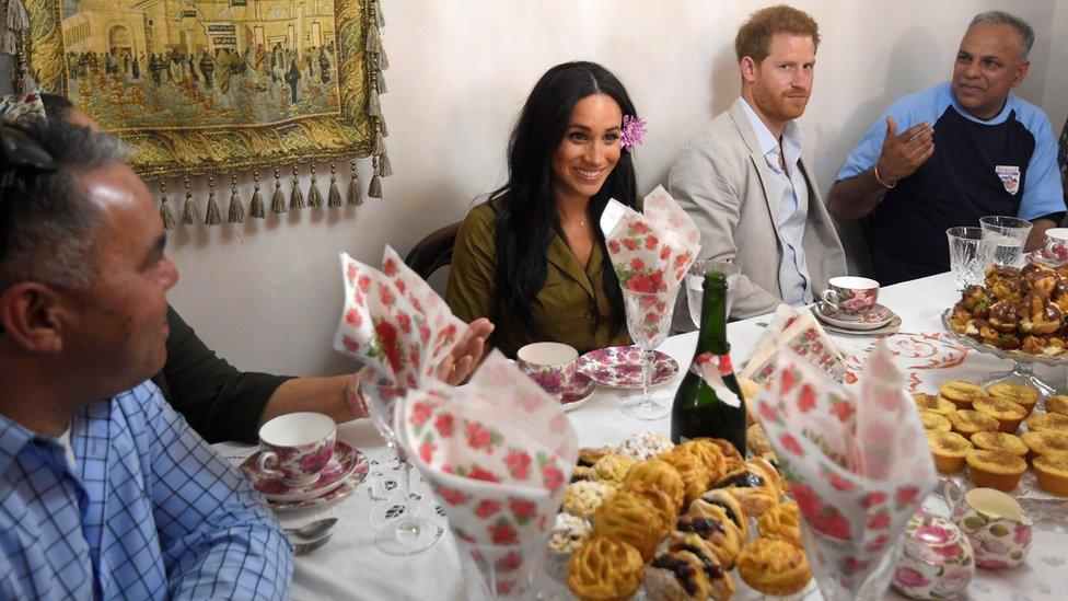 Harry and Meghan at a family's home in Cape Town